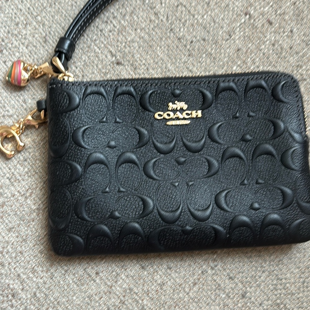 Coach black wristlet.